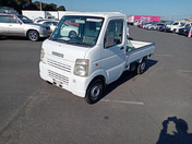 It is a picture of the white suzuki carry truck truck in 2009,First Photo Stock No.Y063125